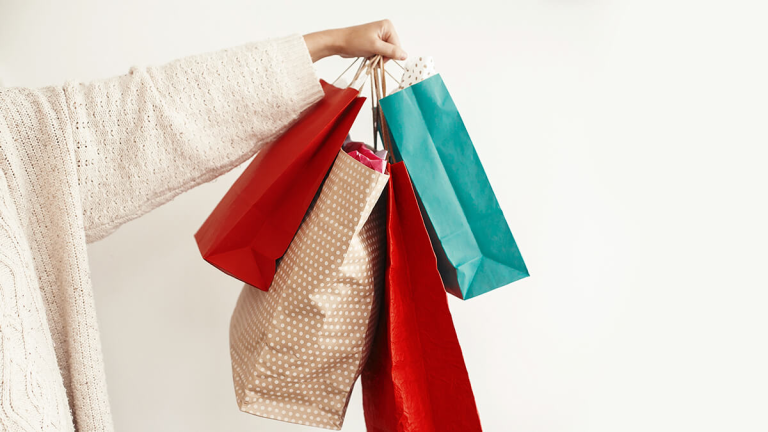 Styli-shop shopping bags being held