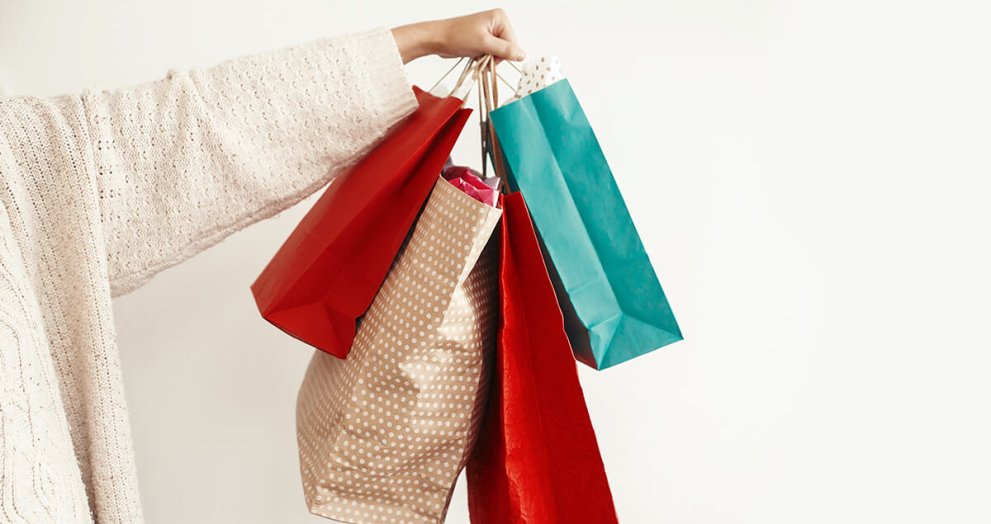 Styli-shop shopping bags being held